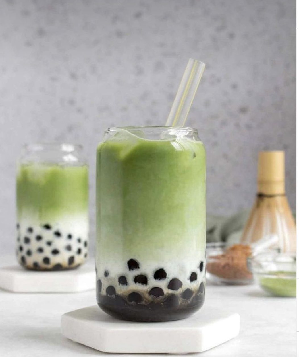 Refreshing iced matcha bubble tea made with premium MB Superfoods matcha powder, creamy milk, and chewy tapioca pearls, served in a glass with a straw