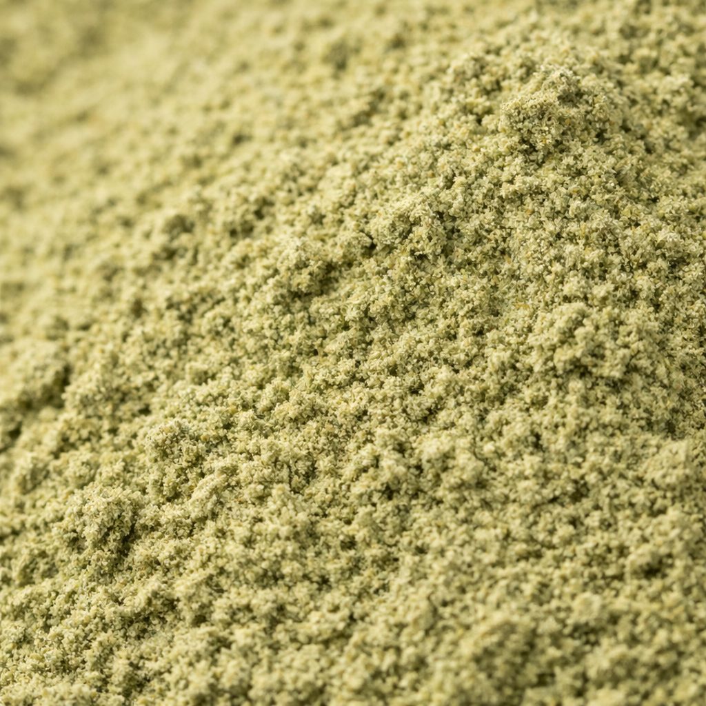 Fine green Maeng Da kratom powder showing natural texture and consistency